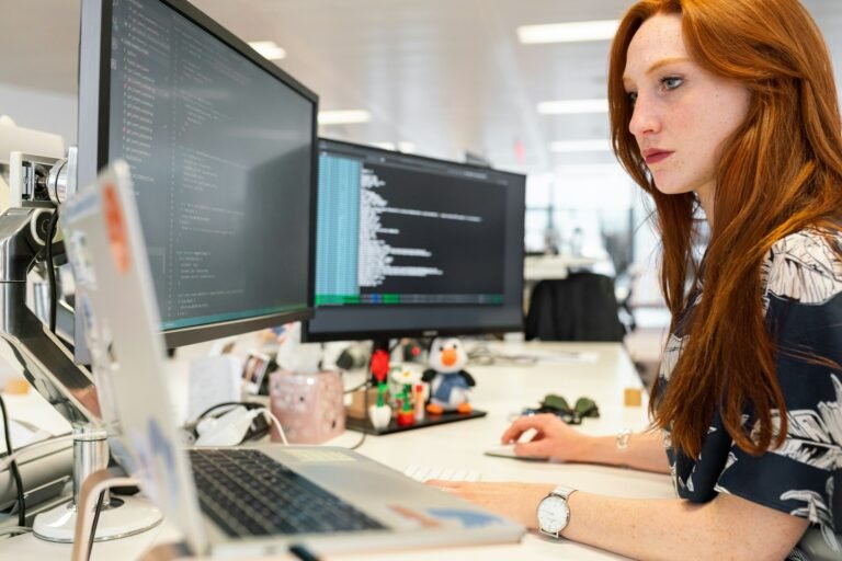 Software engineer writing code at a computer