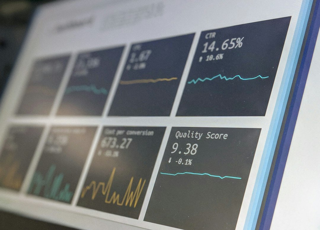 Laptop showing a data reporting dashboard with charts and project metrics